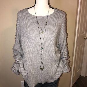 Paper Crane Ribbed Sweater Shredded Sleeve Detail